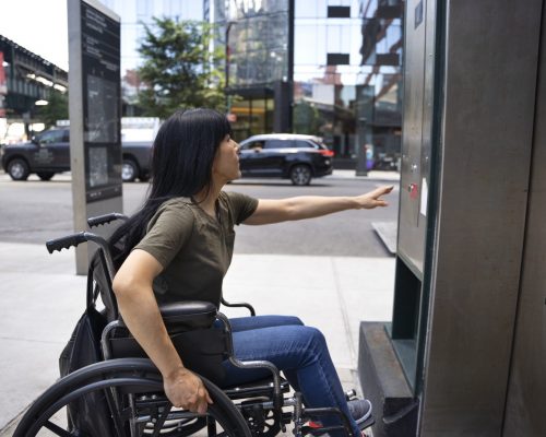 side-view-disabled-woman-by-elevator